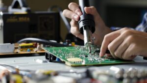 Technician inspecting refurbished electronics
